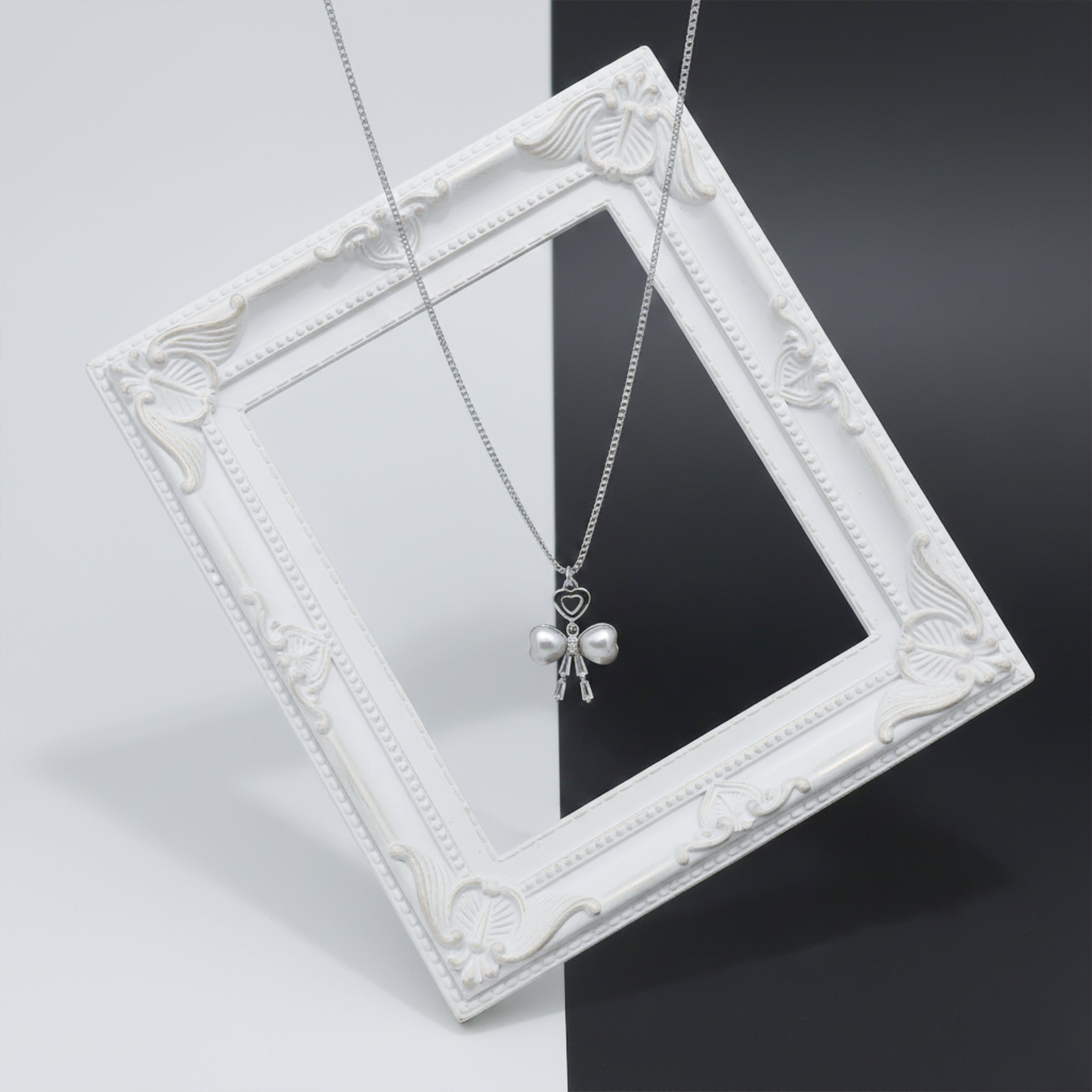 Elegant Silver Heart & Pearl Bow Necklace
