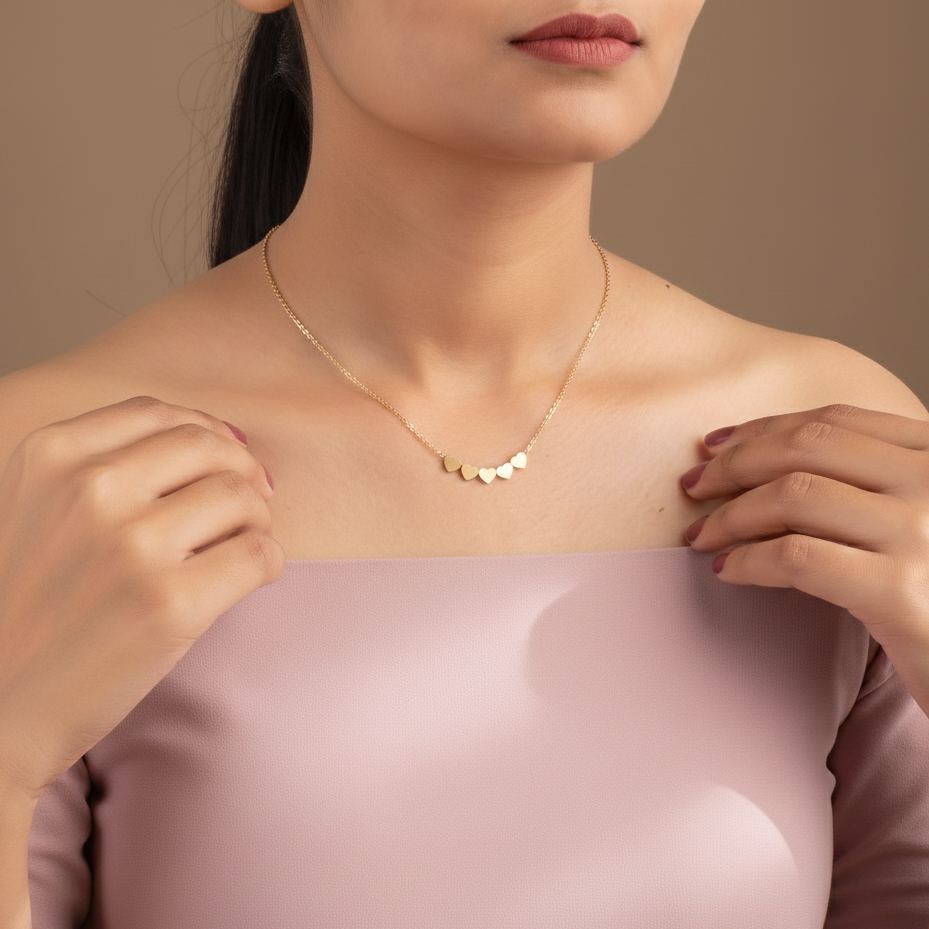 Woman wearing a gold necklace with a minimalistic design against a neutral background